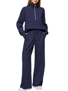 Detail of navy blue women's half-zip sweatshirt and wide-leg jogger lounge set
