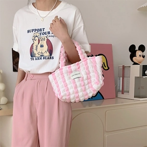Detail of pink and white striped bubble canvas tote bag with textured scrunchie fabric