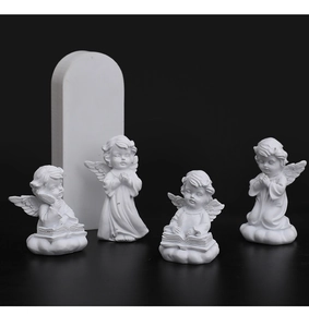 Detailed view of four white resin cherub angel figurines reading and praying on clouds