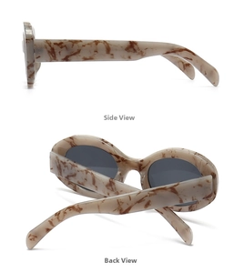Detail view of oval marble pattern sunglasses with wide temples and dark grey lenses