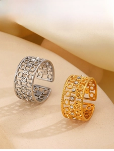Detail of 18K gold and silver plated open rings featuring hollow circles and crystals