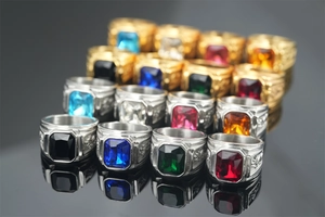 Macro shot of titanium steel dragon rings with various colorful square-cut gemstones
