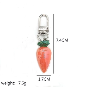 Mini resin carrot keychain with silver ring, size 7.4x1.7cm and 7.6g weight