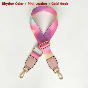 Macro detail of rainbow gradient strap with pink leather ends and gold alloy hooks
