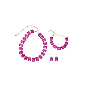 Elegant gold-plated jewelry set featuring rectangular rose red crystals on white background