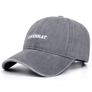 Close-up of COVENRAT white embroidery on dark gray washed cotton baseball cap