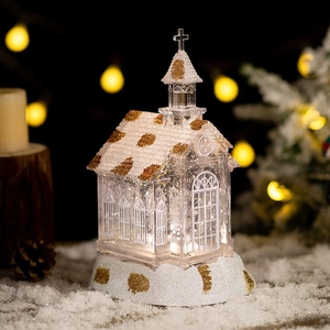 Lighted crystal church music box with gold glitter and warm LED glow for Christmas decor