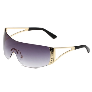 Frameless Y2K sports sunglasses with purple gradient lenses and gold rhinestone temples