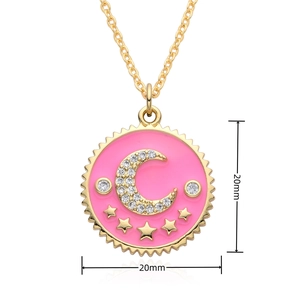 Detail of 20mm round pink enamel pendant with golden moon and star zircons necklace