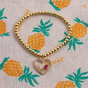 Bracelet élastique en perles dorées avec pendentif cœur et cristal marquise rouge