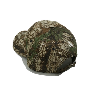 Detail of camouflage baseball cap with metal buckle and adjustable back strap closure