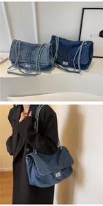 Detailed views of light and dark blue denim tote bags with silver chain straps