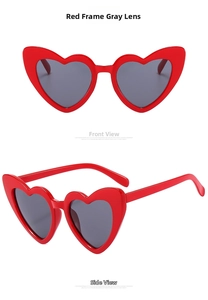 Detail view of heart-shaped red sunglasses with grey lenses in front and side angles