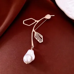 French vintage baroque pearl brooch with rose gold metal and pink gemstone accent