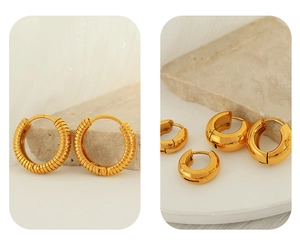Detail view of gold stainless steel hoop earrings featuring textured and smooth finishes