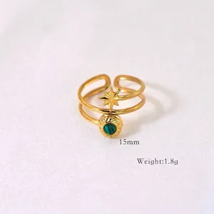 Detailed macro view of 15mm gold star ring with malachite stone inlay weighing 1.8g