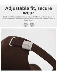 Detail of adjustable metal buckle on dark brown canvas baseball cap with embroidered letter F