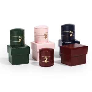Vintage leather-textured jewelry box in cylindrical and square shapes for rings and studs