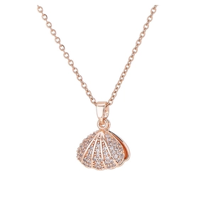 Close-up of rose gold shell pendant with micro-paved crystals on an elegant chain