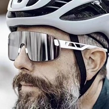 Detail view of silver mirrored cycling glasses with white frame and protective lens