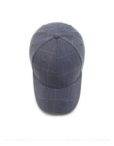 Top view of a dark grey plaid baseball cap with textured cotton fabric and top button