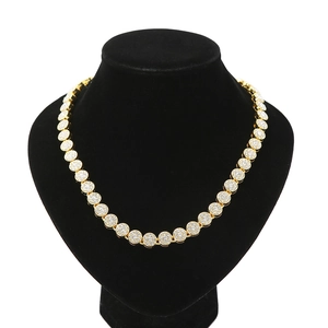Detailed view of iced-out gold Cuban link necklace featuring micro-pave crystals on bust
