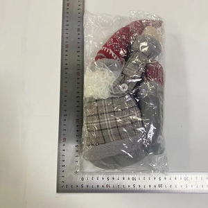 Detail of knitted Christmas gnome curtain buckle with measurement scale 31cm height