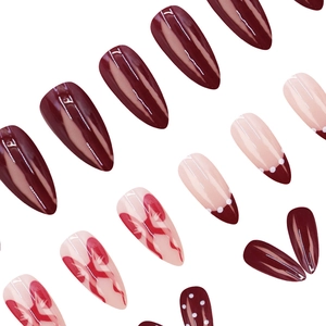 French style stiletto press-on nails in burgundy red with ribbon and polka dot designs