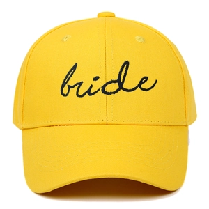 Bright yellow cotton baseball cap with black embroidered Bride cursive text