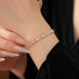 Elegant gold double-layered chain bracelet featuring sparkling white zircon stones