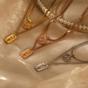 Three-color layered necklaces with star moon and tarot pendants on silk fabric
