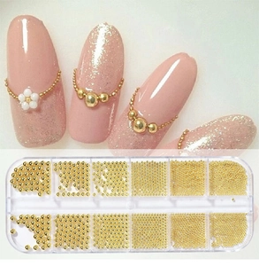 Detailed view of mixed gold caviar nail art beads in a 12-slot clear storage box