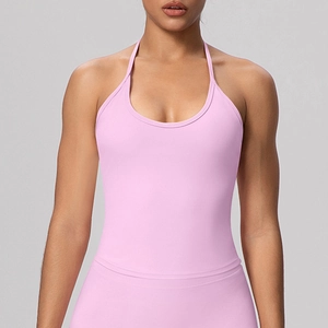 Close-up of pink halter neck sports bra with cross-back straps and ribbed texture