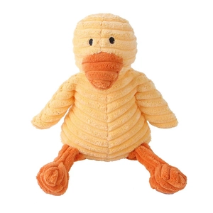 Detail of yellow corduroy plush duck dog toy with textured stripe surface and orange beak