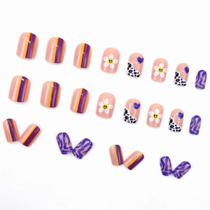 Colorful press-on nails with stripes, daisies, smiley faces, and cow patterns, 24pcs set