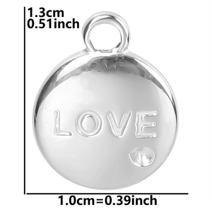 Macro shot of silver LOVE engraved circular charm with a small diamond and size details