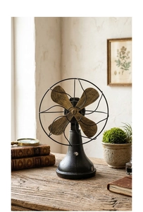 Detail of vintage industrial desk fan model with matte black metal and wood grain blades