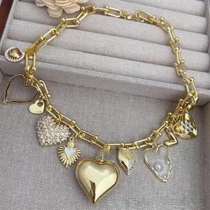 Close-up of 18k gold plated heart necklace with zircon and pearl in a velvet box