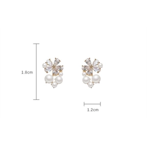 Detail view of 1.8cm flower earrings with zircon petals and white faux pearls