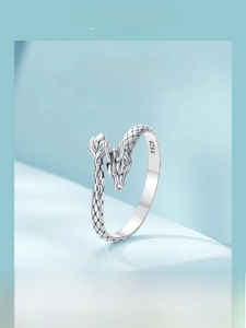 Detailed close-up of coiled S925 sterling silver dragon ring showing scale texture