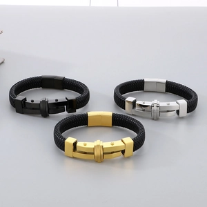 Detail of men's braided leather bracelets with gold, silver and black metal clasps