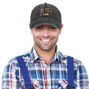 Close-up of GRANDIR floral embroidery on washed black cotton baseball cap with curved brim
