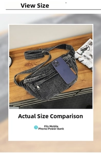 Size comparison of washed denim chest bag next to a large smartphone for capacity view