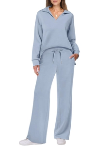 Women's light blue loungewear set featuring long sleeve polo top and drawstring wide leg pants