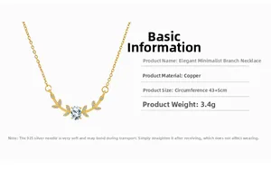Detail of gold branch necklace featuring an oval zircon inlay and sparkling accents