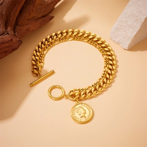 Golden double-layered Cuban chain bracelet with Elizabeth II coin charm and OT toggle clasp