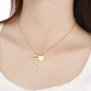 Gold MAMA letter necklace with crystal heart pendant on female model wearing white