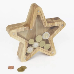 Macro detail of star-shaped oak wood money box with transparent panel and coins inside