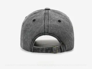 Close-up of vintage washed grey baseball cap with adjustable metal buckle and air holes