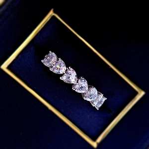 S925 silver heart shaped eternity ring with sparkling row of heart cut stones